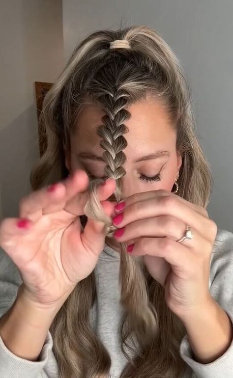 This is a guide on an easy faux Dutch braid. Learn a cute new hairstyle in this quick tutorial. How To Dutch Braid Into Ponytail, How To Dutch Braids, Casual Braids For Medium Hair, Loose Double Braids, Center Braid Hairstyles, Half Up Braid Tutorial, French Braid Buns Double, Middle Braid Hairstyles, Fake Dutch Braid Hair Tutorials