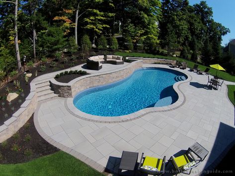 Landscape by Triad Associates, Inc. Pools With Retaining Walls Sloped Backyard, Paver Colors, House Pool Ideas, Pool Retaining Wall, Pool And Patio Ideas, Pool Playground, Paver Patterns, Simple Pool, Pool Pavers