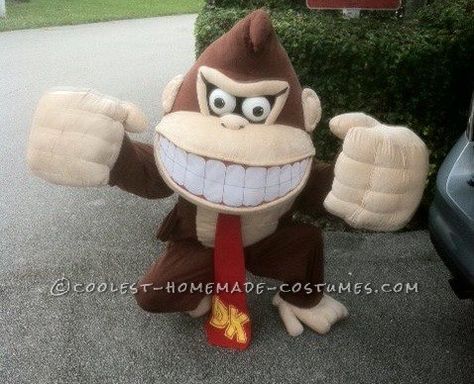 This is a Donkey Kong costume I made. The base of the head piece is paper mache. I covered the base with batting and then the brown fabric. I stuffed bits of fiber fill into the peak of the pointed area on top of the head. The mouth was added over the brown fabric. I made ... Read more The post Handmade Donkey Kong Costume appeared first on Coolest Homemade Costumes. Donkey Kong Costume, Costume Green, Green Halloween, A Donkey, Homemade Costumes, Halloween Costume Contest, Comic Shop, Mario Brothers, Halloween Contest