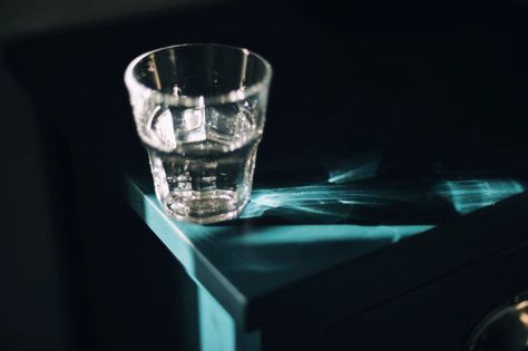 Glass of water in strong sunlight on bedside table Water At Night, Bottles Of Water, Water In The Morning, Bedside Desk, Popsugar Fitness, Glass Of Water, Lifestyle Habits, Falling Asleep, Toning Workouts