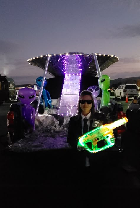 Men in black trunk or treat Men In Black Trunk Or Treat Ideas, Car Halloween Costumes Trunk Or Treat, Aliens Trunk Or Treat, Area 51 Trunk Or Treat, Trunk Or Treat Alien Theme, Men In Black Trunk Or Treat, Robot Trunk Or Treat, Space Trunk Or Treat Ideas For Cars, Alien Trunk Or Treat Ideas For Cars