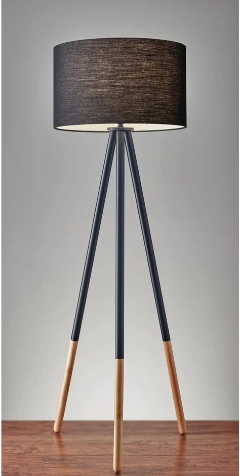 With a classic tripod stance, the Louise floor lamp offers plenty of design versatility. The black painted metal legs and fabric drum shade easily suit contemporary and modern spaces, while the eco-friendly rubber wood leg tips soften the look for urban, casual, or updated lodge looks. Black Metal Floor Lamp, Black Tripod Floor Lamp, Lodge Look, Unique Table Lamps, Tripod Floor Lamp, Wood Floor Lamp, Floor Standing Lamps, Metal Floor Lamps, Metal Floor