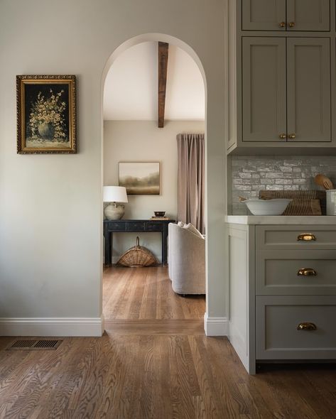 We love all the details that went into the English-inspired kitchen at our Modern Tudor project. The palette includes Farrow & Ball’s School House White, Wimborne White, and Dropcloth — which pair beautifully with the honed Calacatta Caldia marble, handcrafted zellige tile, and unlacquered brass. School House White Kitchen, School House White, Modern Tudor, Wimborne White, House White, Farrow And Ball, Zellige Tile, Street House, Interior Kitchen