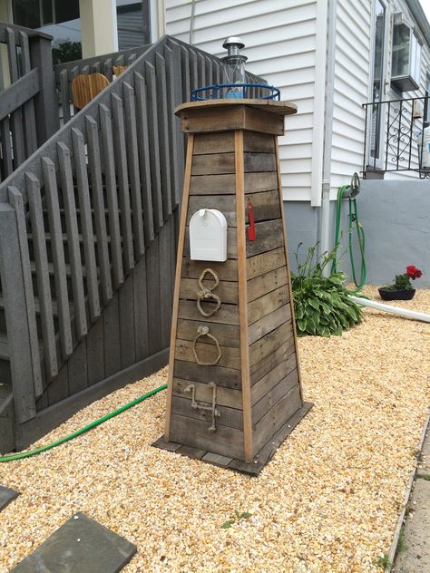 Lighthouse mailbox. We made this for my sister, it looks great in her front yard! Lighthouse Mailbox Ideas, Lighthouse Yard Decor, Beach Themed Front Yard, Lake House Mailbox Ideas, Beach Mailbox Ideas, Nautical Mailbox Ideas, Diy Lighthouse Outdoor, Coastal Mailbox, Yard Lighthouse