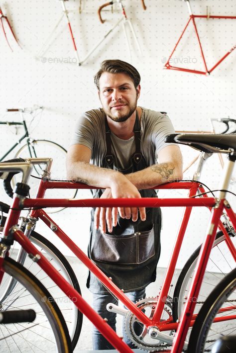 A man working in a bicycle repair shop. by Mint_Images. A man working in a bicycle repair shop. #Sponsored #bicycle, #working, #man, #Mint_Images Man Working, Bicycle Repair, Bike Mechanics, Bike Repair, Repair Shop, Bike Shop, Baby Strollers, A Man, Bicycle