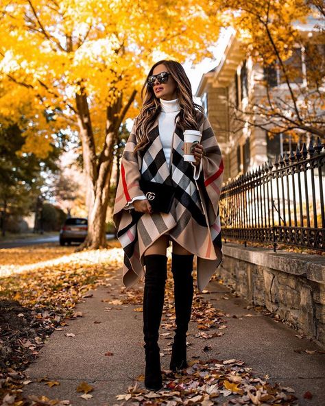 Fashion blogger mia mia mine wears a burberry plaid poncho over a sweater dress and over the knee boots for fall. To see more chic burberry outfits, how to wear a poncho, or sweater dress and boots, click through to my blog. #falloutfits #burberry #otkboots Burberry Outfits, Burberry Poncho, Layering Outfits Fall, Rome Fashion, Mia Mia Mine, Mia Mia, Ways To Wear A Scarf, Estilo Chic, Fashion Blogger Style