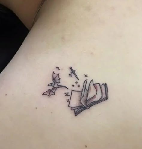 Book With Wings Tattoo, Unique Fantasy Tattoos, Fantasy Tattoo Designs Drawings, In Memory Best Friend Tattoos, Tattoos For Fantasy Book Lovers, Minimalist Throne Of Glass Tattoo, Booktok Inspired Tattoos, Tiny Throne Of Glass Tattoo, Sister Tattoos Books