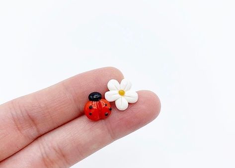 PhoYoSelf on Instagram: “Mixmatched earrings - ladybug and flower 🐞 🌸 #polymerclay #polymerclayearrings #polymerclayjewelry #polymerclayladybug #ladybugearrings…” Cute Stud Earrings, Clay Earring, Bungalow House Design, Bungalow House, Art And Crafts, Lady Bug, Polymer Clay Jewelry, Polymer Clay Earrings, Clay Earrings