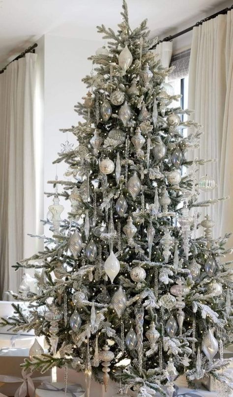 Flocked Tree Christmas Decor, Flocked Christmas Tree With Icicles, White Silver Crystal Christmas Tree, Silver White Tree Christmas, White And Metallic Christmas Tree, White Silver And Green Christmas Tree, Crystal Decorated Christmas Trees, White And Crystal Christmas Tree, White Crystal Christmas Tree