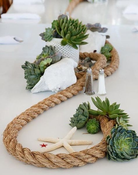 a beachy centerpiece with rope, succulents, starfish, a seashell and potted greenery Nautical Centerpiece, Creative Wedding Centerpieces, Beach Wedding Tables, Creative Centerpieces, Beach Wedding Centerpieces, Rustic Wedding Decorations, Beach Table, Tafel Decor, Sea Wedding