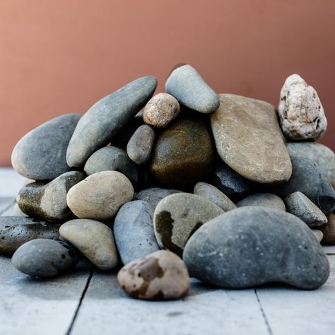 Nambucca Oversize Previous Next Nambucca oversize is a beautiful decorative stone with large stones ranging from 50 – 150mm.  This stunning natural river pebble features large rounded stones in neutral tones.  This stone is perfect for those wanting to make an impact with their outdoor design.  Pair it with timber and concrete pavers for a […] River Pebbles, Outdoor Showers, Concrete Pavers, Make An Impact, Stone Decor, Pool Area, Outdoor Design, Neutral Tones, Stone