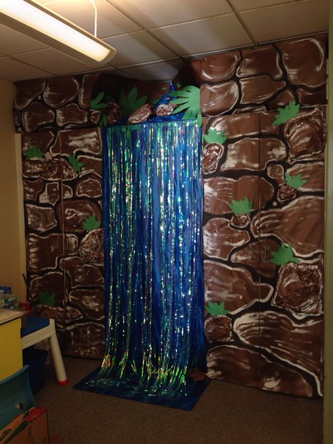 Classroom waterfall for rainforest theme Rainforest Classroom Transformation, Classroom Waterfall, Rainforest Theme Party, Rainforest Classroom, Preschool Jungle, Jungle Rainforest, Rainforest Project, Forest Classroom, Jungle Classroom