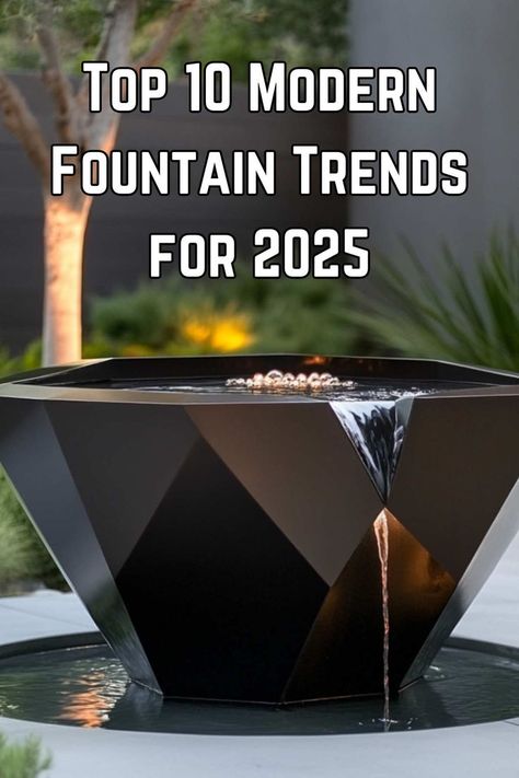 A geometric, black metal fountain in a modern outdoor space, illuminated by soft lighting in the background. Front Yard Landscaping Ideas With Water Feature, Front Entry Water Feature Entrance, Luxury Water Feature, Home Fountains Outdoor, Restaurant Water Feature, Front Porch Fountain Ideas, Modern Water Features In The Garden, Fountain Design Modern, Modern Fountains Outdoor