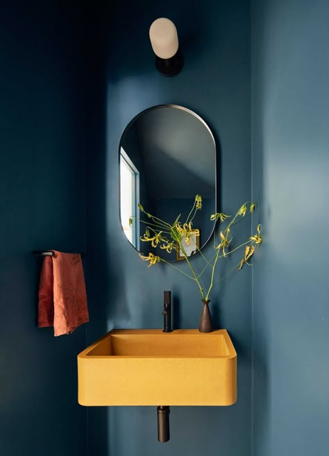 A modern powder room painted in a deep blue-black with a pop of yellow provided by a Kast concrete sink. Street Townhouse, Kitchen Wrap, Patterned Wall, Concrete Basin, Stone Bath, Small Toilet, Downstairs Loo, Toilet Room, Bad Design