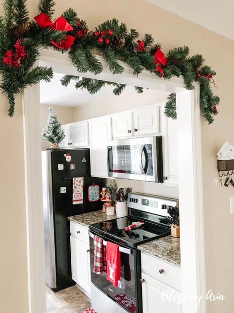 Christmas Garland On Top Of Cabinets, Christmas Decor Ideas Garland Kitchen, Kitchen Cabinet Garland Christmas, Christmas Garland On Kitchen Cabinets, Christmas Garland In Kitchen, Christmas Decor Top Of Fridge, Kitchen Cabinets Christmas Decorations, Christmas Garland Above Kitchen Cabinets, Christmas Aesthetic Kitchen