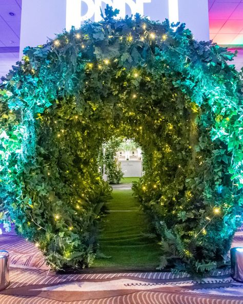 Let your guests enter through our Foliage tunnel for an exciting guest event walkway. Add colours and textures through flowers and lighting to add to the drama. Great for Madhatter themed events, festival décor, enchanted forest parties and many more green themes. Event Walkway, Enchanted Forest Dance, Enchanted Theme, Enchanted Forest Prom, Flower Archway, Enchanted Forest Decorations, Tangled Lanterns, Enchanted Forest Party, Enchanted Forest Theme