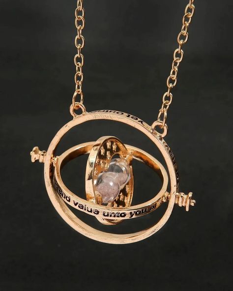 Turn back time with the iconic Time-Turner necklace ⏳✨. A symbol of magic and mystery, this Harry Potter accessory is perfect for those who wish to relive every magical moment. #HarryPotter #TimeTurner #MagicalJewelry Spinning Jewelry, Time Necklace, Time Turner, Golden Pendant, Magic Props, Magical Accessories, Sigil Magic, Magical Jewelry, Sweater Chain