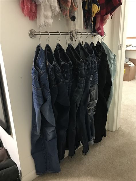 Jean Rack Closet Ideas, Towel Bar For Pants, Pants Hanging Ideas, Pant Hanger Ideas Closet Space, Diy Trouser Rack, Denim Bar Closet, Hang Jeans With S Hook, Towel Rack Closet Hack, Ways To Hang Jeans In Closet