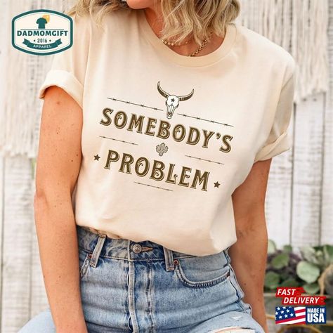 Somebody’S Problem Shirt Country Music Cowgirl T-Shirt Hoodie Check more at https://dadmomgift.com/product/somebody-s-problem-shirt-country-music-cowgirl-t-shirt-hoodie/ Somebodys Problem Shirt, Howdy Shirt, Country Music Shirt, Country Music Shirts, Cowboy Shirt, Cowgirl Shirts, Cowboys Shirt, Film Prints, Country Western