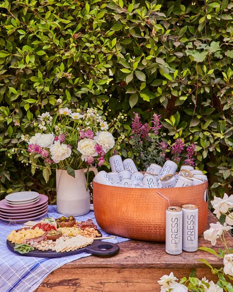 How To Throw An Elevated Garden Party with PRESS Premium Seltzer + Sustainable Outdoor Party Styling Tips - Emily Henderson Elevated Garden Party, Elevated Garden, Metal Candle Lanterns, Grey Plates, Party Styling, Pink Napkins, Beverage Tub, Celebrate Good Times, Christmas Planning