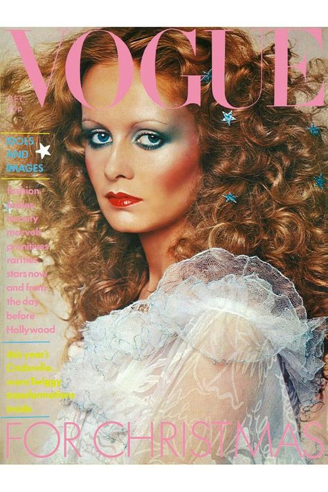 Vogue | Dec 1974 | Twiggy as Vogue's Cinderella in Zandra Rhodes' white silky chiffon and net, ruffles edged with turquoise thread, little flowers sprinkling the skirt; to order at Fortnum & Mason. Golden necklet, by Mick Milligan, at Liberty. Hair by Celine, highlights by Daniel. The stars, £1.59 to order, at Leonard. Make-up by Barbara Daly, using Estée Lauder. Scent - Alliage. Photograph by Barry Lategan. 70s Makeup Disco, Disco Hair And Makeup, 70s Disco Hair, Twiggy Hair, 1970s Makeup, Look Disco, Disco Makeup, Disco Hair, 1970s Hairstyles