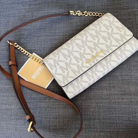 Brand New Hard To Find Mk Large Phone Crossbody Bag Clutch Vanilla Color With Mk Signature Design Gold Hardware Mk Lettering On The Front Detachable Long Strap 25" Drop Flap With Snap Closure Interior: One Bug Compartment For Your Phone One Zipper Compartment One Currency Compartment Approximately 8"L X 5.25"H X1.5"W Iphone 8 Fits Into It Pet & Smoke Free Home Please See My Entire Collection Mk Crossbody Bag, Mk Purse, Women's Bags By Style, Luxury Bags Collection, Michael Kors Crossbody Bag, Handbag Essentials, Mk Bags, Girly Bags, Luxury Purses