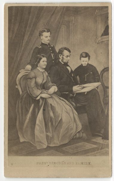 Abraham Lincoln, seated, next to his wife, Mary, with Thomas"Tad", 12, to the right, and Robert, 22, standing behind, in uniform. This 1865 photograph was of an engraving by Adam B. Walter based on a painting by F. Schell based on separate photographs of Robert, Lincoln and Tad, and Mary. The partially visible framed picture on the wall is Willie Lincoln, who died in 1862. Robert Todd Lincoln, Abraham Lincoln Family, Fashion History Timeline, Mary Todd Lincoln, Foundation Collection, Portrait Cross Stitch, Chicago History Museum, Family Images, Family Album