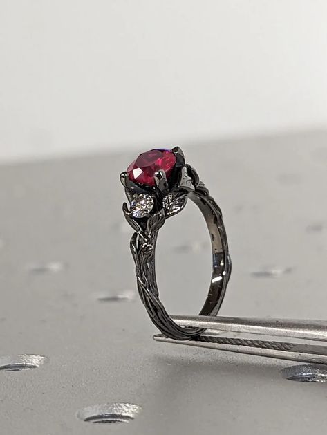 MAIN STONE
Type: Conflict Free Cultured Ruby
Cut: Round
Color: Red
Clarity: Eye-Clean (VS Clarity)

#1ct #Round #Lab #Ruby #14K #Black #Gold #Gothic #Promise #Ring #Nature #Inspired #Leaves #Motif #Engagement #Ring #Custom #Wedding #Anniversary #Ring #engagement #ring #wedding #ring #promise #ring #custom #ring #unique #rings #Lab #Ruby #Ring #round #ruby #ring #vintage #leaf #ring #gothic #ring #black #gold #ring #nature #inspired #ring #solitaire #ring #red #gemstone #ring Vibe Nature, Goth Wedding Ideas, Ring Images, Ruby Engagement Rings, Ruby Wedding Ring, Engagement Ring Types, Wedding Ring Silver, Engagement Ring Custom, Ruby Ring Vintage