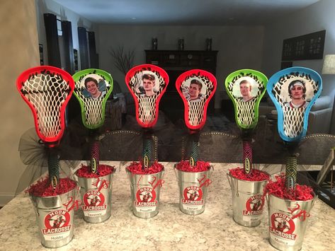 Lacrosse centerpieces. Container from At Home, sticks are Pool Lax from Target. Lacrosse Bouquet, Lacrosse Graduation Party Ideas, Lacrosse Centerpiece Ideas, Lacrosse Banquet Centerpieces, Lacrosse Centerpieces, Lacrosse Birthday, Baseball Banquet, Lacrosse Party, Sports Centerpieces