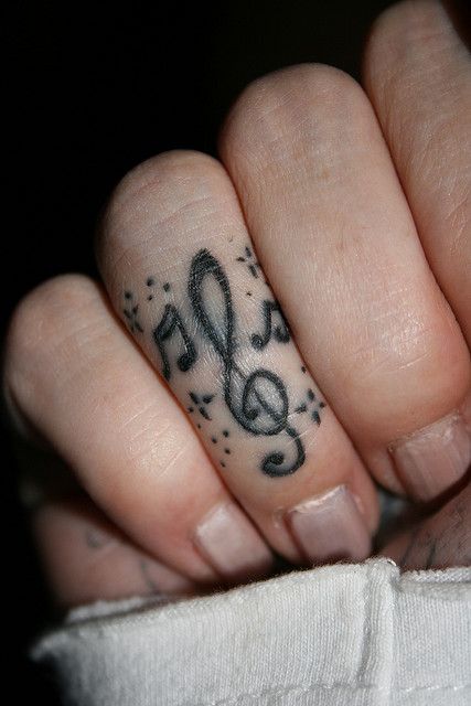 . Rockstar Gf Tattoo Ideas, Tuning Fork Tattoo, Music Note Finger Tattoo, Emo Finger Tattoos, Emoticon Tattoo, Plaid Tattoo, Music Themed Tattoos, Tattoo Ideas Wrist, Music Related Tattoos