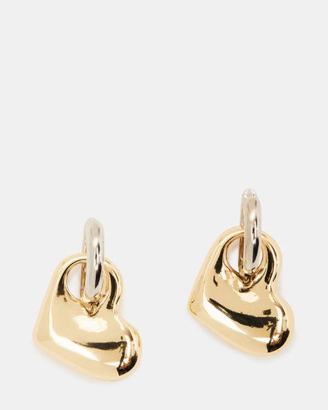 The PUFFY HEART HUGGIE earrings feature a charming two-tone design and a playful dangle.  Heart shaped huggie earrings Hinge closure Length: 1.25" Width: .6" Metal material Imported Heart Theme, Summer Boots, Y2k Coquette, Puffy Heart, Huggie Earrings, Gold Hoops, Metal Material, Gold Hoop, Huggies Earrings