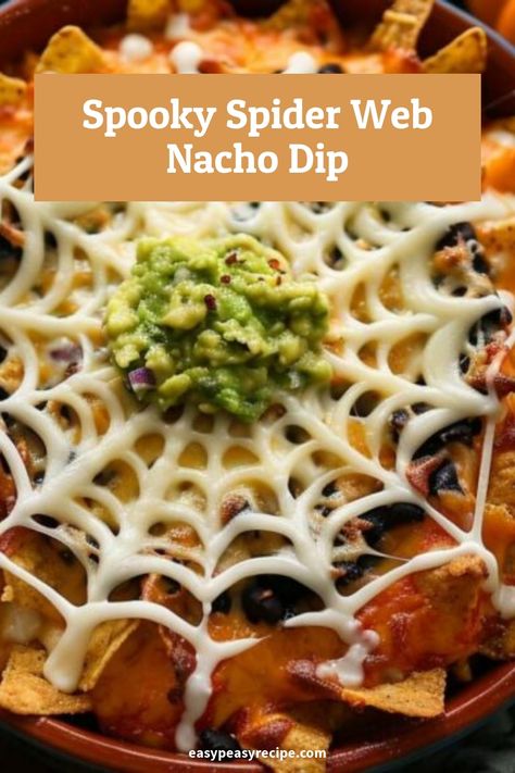 Nacho dip decorated with a spider web design made of sour cream and topped with guacamole. Spooky Nachos, Spooky Bean Dip, Halloween Nachos, Spider Web Taco Dip Recipe, Taco Dip Spider Web, Halloween 7 Layer Dip Spider Webs, Guacamole Spider Web Dip, Halloween Bean Dip Spider Webs, School Cookies Recipe