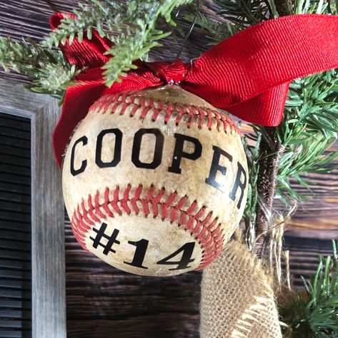 This Baseball is transformed into a unique Holiday Ornament complete with hook, holiday ribbon, name and number or year. Please make sure to let us know what name and number you would like on the ball.  If you search our site you can also order a Softball Ornament. Diy Baseball Ornaments, Baseball Ornaments Diy, Softball Art, Baseball Christmas Tree, Baseball Snowman, Baseball Banquet, Baseball Christmas Ornaments, Softball Ornaments, Sports Crafts