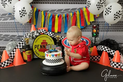 race car themed cake smash birthday party photo, formula one, cones, red suit, balloons, celebrate, driver, theme, themed, little boy, sprinkles, little man, passion, cars, racing, GilmoreStudios.com Beach Cake Smash, Ferrari Party, Race Car Cakes, Race Car Themes, Beach Cake, Cars Cake, Smash Cakes, Race Suit, Red Race