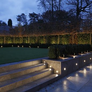 4.Illumination for safety Exterior pathways and steps can be illuminated using wall or floor recessed lighting. This can be an important safety feature but also as a visual effect to draw the eye between different tiers of the garden and to bring focus to beautiful stone paving. Retaining Wall Lighting, Stairs Decoration, Garden Path Lighting, Garden Spotlights, Garden Wall Lights, Driveway Lighting, Patio Steps, Architectural Lighting Design, Step Lighting Outdoor