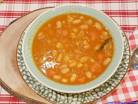 Greek Fasolada-White Bean soup is one of the most popular traditional dishes of Greek cuisine and established as the “Greek National Food”. This vegan soup is perfectly cooked in tomato sauce with various vegetables. . #Fasolada #beansoup #soup #φασολάδα #greece #greek #greekrecipes #greekfood #vegan #fasting #greekcookingmadeeasy #yummy #love #instagreece #igersgreece #foodlover #hellas #ελλάδα #mediterranean #eatgreek #greekyoutuber Fasolada Soup Greece, Greek Bean Soup, Eat Greek, Bean Soup Recipes, Greek Cooking, White Bean Soup, Greek Dishes, Savory Soups, Vegan Soup