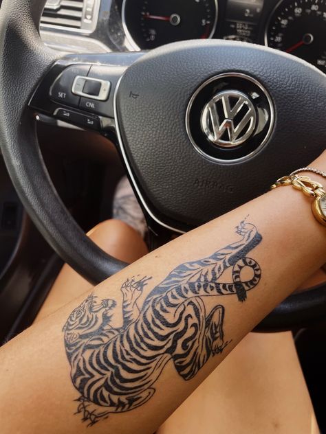 Tiger On Forearm Tattoo, Tiger Tattoo On Rib Cage, Tiger Prowling Tattoo, Tiger And Jaguar Tattoo, Tiger Tattoo Forearm Women, Patchwork Tiger Tattoo, Ornamental Tiger Tattoo, Tiger Ankle Tattoo, Tiger Tattoo Upper Arm