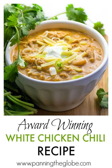 It's easy to cook a big pot of this award winning white chicken chili, and it's the absolute BEST! Tender chicken, chilies, white beans, spices and a few more goodies in this winning white chicken chili recipe! Top with sour cream, cheese, scallions, a drizzle of your favorite hot sauce. It's makes a lot of chili, but it freezes really well! #chicken #chili #recipe #ChickenChili Award Winning White Chicken Chili Recipe, Award Winning White Chicken Chili, White Chicken Chili Healthy, White Chicken Chili Slow Cooker, White Chicken Chili Recipe, Chili Chili, White Bean Chicken Chili, White Chili, White Chili Chicken Recipe