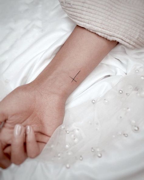 Simple cross wrist tattoo by @tinytattoos_feathertouch Beautiful Wrist Tattoos, Cross Wrist Tattoo, Tiny Cross Tattoo, Inner Wrist Tattoos, Wrist Tattoos Words, Symbol Ideas, Infinity Tattoo On Wrist, Cross Tattoo On Wrist, Small Cross Tattoos