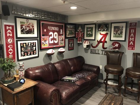 Sport Mancave Ideas, Man Cave Media Room Ideas, College Football Basement, Sports Living Room Decor, Sports Room Man Cave Football, Basement Game Room Wall Decor, Sports Theme Living Room, Classy Sports Basement, Alabama Man Cave Ideas