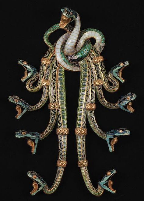 Serpents pectoral in gold and enamel, René Lalique, circa 1898-99: Nine serpents entwined in a knot from which the bodies of eight cascade, the ninth rising in the centre, all in the attack position. Strings of pearls hung from the exposed fangs with a similar corsage ornament (the whereabouts of which are currently unknown), highlighted at the 1900 Paris Exposition and reproduced in a publication of the period. The present piece is thus probably the only one in existence. Strings Of Pearls, Lalique Jewelry, Serpent Snake, Nouveau Jewelry, String Of Pearls, Art Nouveau Jewelry, About Art, Source Of Inspiration, Lalique