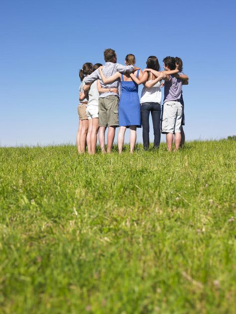 Group of People in Huddle in Field. A group of people huddle in a field. Vertica , #ad, #Field, #group, #Huddle, #Group, #People #ad Group Hug, Island Town, A Group Of People, Group Of People, Group Of Friends, A Group, Stock Photography, Photo Image, Royalty Free Stock Photos