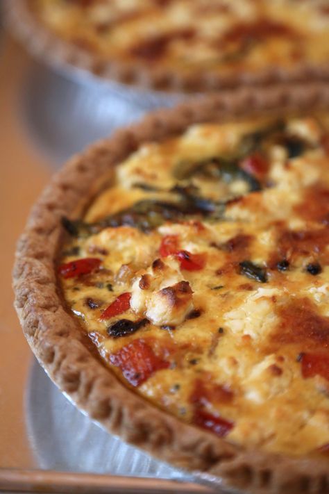 Quiche is one of our favorite foods, because it can be enjoyed at breakfast, lunch, or dinner. This Mediterranean-inspired quiche filling has a combination of sautéed onions, zucchini, red peppers, and sun-dried tomatoes; gruyere and goat cheese provide a luxurious richness. It's a perfect easy meatless meal, and it's so good you may end up eating half of one quiche in a sitting! Mediterranean Quiche Recipes, Mediterranean Quiche, Brunch Favorites, Savoury Tarts, Mini Meals, Sautéed Onions, Mediterranean Foods, Savory Tarts, Eggs Recipes