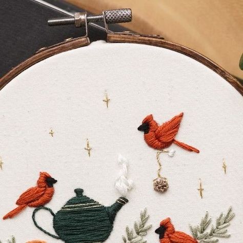 Magnus & Quill Embroidery on Instagram: "One of my favourite new patterns! These sweet cardinal birds decided to make a spot of tea while enjoying a good read among the table arrangements 😆 Oranges seemed fitting and give it a slight Christmas feel! I can’t wait for Christmas holidays, and to just drink tea and read books for days 🥰📚 Available as a PDF Digital Download on Etsy, this Pattern includes: 🎄Step By Step instructions (with photos of the actual pattern being stitched) 🎄Colour Guide (dmc) 🎄Supply List (including needle size, hoop size, best fabric to use) 🎄YouTube Tutorials (access to private YouTube videos showing the pattern being stitched so you can follow along or reference easily!) #embroiderypattern #beginnerembroidery #dmcthreads @dmc_embroidery @michaelsstores @lovec Cardinal Knitting Pattern, Embroidered Cardinal Bird, Red Bird Embroidery, Cardinal Embroidery Pattern, Cardinal Embroidery, Colour Guide, Good Read, Dmc Embroidery, Drink Tea