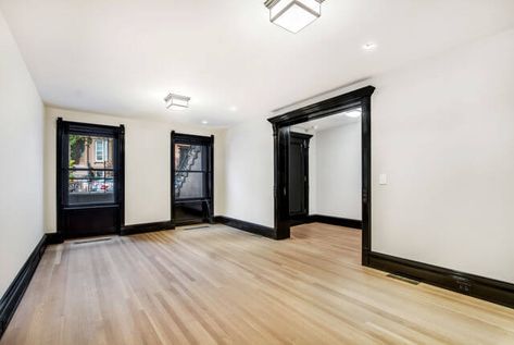 White Walls Black Molding, Black Painted Moldings And Trim, Black Trim Light Floors, White Bedroom Black Trim, Black Wall Trim Interior, Black Trim Baseboards, White Living Room With Black Trim, White Walls Black Trim And Doors, White Room With Black Trim