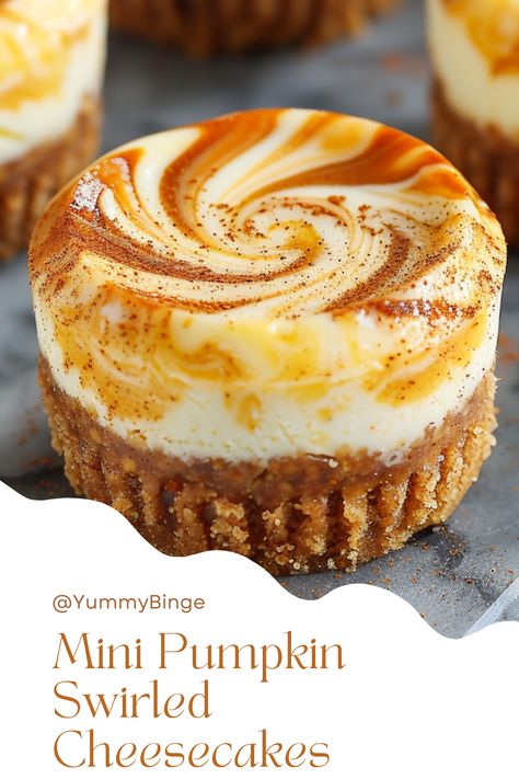 Mini Pumpkin Swirled Cheesecakes Thanksgiving Work Potluck Recipes, Graham Cracker Crust Pumpkin Cheesecake, Mini Pumpkin Swirl Cheesecake, No Bake Pumpkin Roll Cheesecake, Swirled Pumpkin Cheesecake, Cheesecakes For Thanksgiving, Christmas Pumpkin Desserts, Pumpkin Mini Cheesecakes, Desserts For Friendsgiving