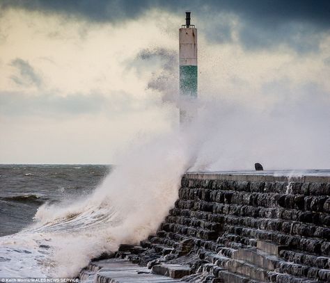 Incoming: Stormy seas at high tide with strong winds brought huge waves to lash the promen... Stormy Seas, Huge Waves, Rain Storm, Stormy Sea, High Tide, Strong Wind, Ocean Waves, Niagara Falls, Natural Landmarks