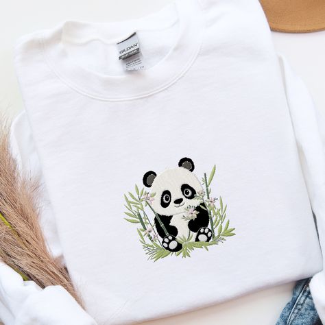 𝑬𝒎𝒃𝒓𝒐𝒊𝒅𝒆𝒓𝒆𝒅 𝑷𝒂𝒏𝒅𝒂 𝒔𝒘𝒆𝒂𝒕𝒔𝒉𝒊𝒓𝒕 🐼 🐼 This adorable and whimsical panda Sweatshirt is a great addition to your all season wardrobe, especially in spring! 🌼 It's prefect for taking a walk, running errands, chilling at home, or hanging out with friends! Our crewnecks are made from the highest quality fabric for an incredibly soft and comfortable fit. You can find the sweater in my Etsy Shop 🤍 👉🏻 link in Bio #embroiderydesigns #embroideredart #embroidery #sweatshirtforwomen #embroidered #embroider... Panda Embroidery, Panda Sweater, Hanging Out With Friends, Chilling At Home, Panda Shirt, Out With Friends, Kawaii Panda, Taking A Walk, White Shirt Men