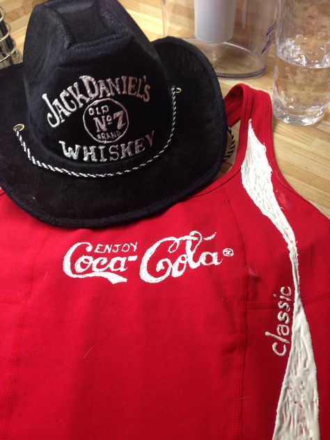 DIY couple Halloween costume! Fabric paint a cowboy hat and a red tshirt! Whiskey and Coke . The girl wears the shirt with accessories and the boy wears the hat with a jack Daniels tshirt! Jack And Coke Costumes, Whiskey And Coke, Jack Daniels Tshirt, Jack Daniels Gifts, Couple Halloween Costume, Halloween Costumes Diy Couples, Halloween Fits, Diy Couple, Jack And Coke