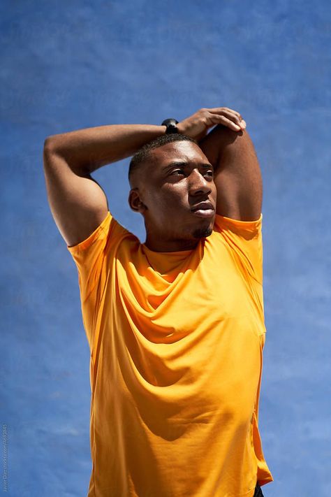 "Athletic young black guy stretching arms at stadium" by Stocksy Contributor "Javier Díez" Arm Stretching Pose Reference, Stretching Arms Up Pose Reference, Guy Stretching Reference, Bended Arms Reference, Stretching Arms Above Head Pose Reference, Person Stretching Arms Reference, Young Black, Get Outside, Black Men